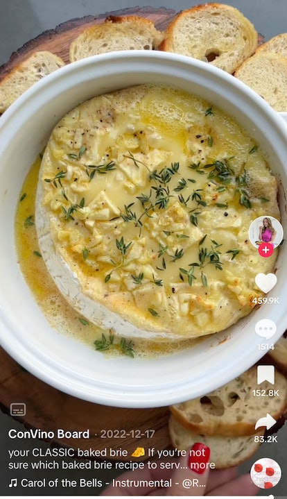 A TikToker shares how to make garlic butter baked brie with a recipe on TikTok. 
